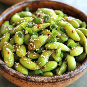 - 2 cups edamame in pods (fresh or frozen) - 3 tablespoons olive oil - 1 teaspoon sesame oil - 4 cloves garlic, minced - 1 teaspoon red pepper flakes - Sea salt, to taste - 1 tablespoon sesame seeds - Chopped green onions You will need a few simple items to make spicy garlic edamame. Start with edamame pods, which can be fresh or frozen. I love using frozen edamame because it saves time. Next, grab some olive oil and sesame oil. These oils add a rich flavor to the dish. You'll also need garlic. Fresh minced garlic gives a strong taste. Add red pepper flakes for heat. You can adjust this based on how spicy you like your food. For garnishing, sea salt enhances the taste. I like to sprinkle sesame seeds on top for crunch. Chopped green onions add a nice touch of color and flavor. With these ingredients, you are ready to create a tasty side dish that everyone will love! To start, bring a large pot of salted water to a boil. If you use frozen edamame, add it to the boiling water. Cook for 5-6 minutes until the pods are tender. If using fresh edamame, rinse it under cold water and then drain. Once cooked, drain the edamame and set it aside. This step is key for a great texture. Next, grab a large skillet and heat the olive oil over medium heat. It should be hot but not smoking. Add the minced garlic and red pepper flakes to the skillet. Sauté for 1-2 minutes. You want the garlic to be fragrant and slightly golden. Be careful not to burn the garlic; burnt garlic can ruin the whole dish. Now, it’s time to add the cooked edamame to the skillet. Stir well to coat each pod with the garlic oil mixture. Sauté everything for an additional 2-3 minutes. This helps the edamame soak up all the tasty flavors. Drizzle the soy sauce and sesame oil over the edamame. Toss everything again to mix well. Cook for one more minute to ensure every pod is flavored. Finally, taste and adjust the salt if needed. Transfer the edamame to a serving dish. Garnish with sesame seeds and chopped green onions. Serve warm and enjoy the burst of flavors! - Adjusting spiciness level: You can change the heat by adding or reducing red pepper flakes. Start with half the amount if you prefer mild. You can also add fresh chopped chilis for a stronger kick. - Alternative garnishes: Instead of sesame seeds, try using crushed peanuts for a crunch. Chopped cilantro or mint can add a fresh twist. - Ensuring garlic doesn't burn: Keep the heat on medium. Stir the garlic often for about one to two minutes. You want it fragrant and slightly golden, not dark brown. - Tips for even flavor distribution: Toss the edamame well in the garlic oil mixture. Use a spatula to ensure each pod gets coated. This helps every bite taste amazing. - Pairing with other dishes: This dish goes well with rice or noodles. It also complements grilled chicken or fish for a balanced meal. - Ideal occasions for serving: Serve spicy garlic edamame at parties or game nights. They make a fun snack to share. Enjoy them as an appetizer before a dinner with friends. {{image_2}} You can mix up the flavors of your spicy garlic edamame. Adding some Asian-inspired ingredients makes it even better. Try adding fresh ginger for a zesty kick. A squeeze of lime juice can brighten the dish. If you prefer it less spicy, cut down the red pepper flakes. You can also use other spices like black pepper or paprika. This way, you can cater to your taste or your guests' taste. For those who are gluten-free, you can find gluten-free soy sauce. This option keeps the dish tasty while meeting dietary needs. Look for tamari, which is a great gluten-free soy sauce. If you want a vegan option for oils, you can swap olive oil with avocado oil. It's a healthy choice and works well in this dish. These simple tweaks make spicy garlic edamame fit for everyone to enjoy. After cooking, let the spicy garlic edamame cool down. Place leftovers in an airtight container. They stay fresh in the fridge for about 3 days. The flavors will get better as they sit. Just reheat them in a pan or microwave before serving again. Want to keep your edamame longer? Freezing is a great option! First, let the cooked edamame cool completely. Spread them in a single layer on a baking sheet. Freeze them for about 1-2 hours. Once frozen, transfer them to a freezer bag. They can last for up to 3 months. When you’re ready to eat, simply thaw and reheat. Enjoy the fresh taste anytime! Edamame is young soybeans, usually served in pods. They are green and soft. You can eat them warm or cold. Edamame packs a punch in nutrition. Each serving is full of protein, fiber, and vitamins. It comes from East Asia, where it has been enjoyed for centuries. Eating edamame can help with heart health and weight control. It is also a great snack for anyone looking to add more plant-based foods to their diet. Yes, you can prepare spicy garlic edamame ahead of time. Cook the edamame and garlic mixture as usual. Let them cool and store them in the fridge for up to two days. When you're ready to eat, simply reheat them in a skillet over low heat. Add a splash of olive oil if needed. This keeps the flavors fresh. You can also microwave them for a quick warm-up. Spicy garlic edamame pairs well with many dishes. You can serve it alongside sushi or rice bowls. It also goes great with grilled meats or stir-fried veggies. If you want a light meal, serve it with a salad. You can even enjoy it as a snack while watching a movie. The flavors are bold and complement different cuisines well. Edamame offers a simple yet tasty dish. You start by cooking fresh or frozen edamame, then mix it with garlic and red pepper flakes for flavor. Add some sesame oil and soy sauce for extra kick. You can customize the spice level and try different garnishes like sea salt or green onions. Serve it with your favorite meals or enjoy it alone. Remember, this dish is easy to store for later. Whether you like it mild or spicy, edamame is a fun, healthy snack that everyone can enjoy!